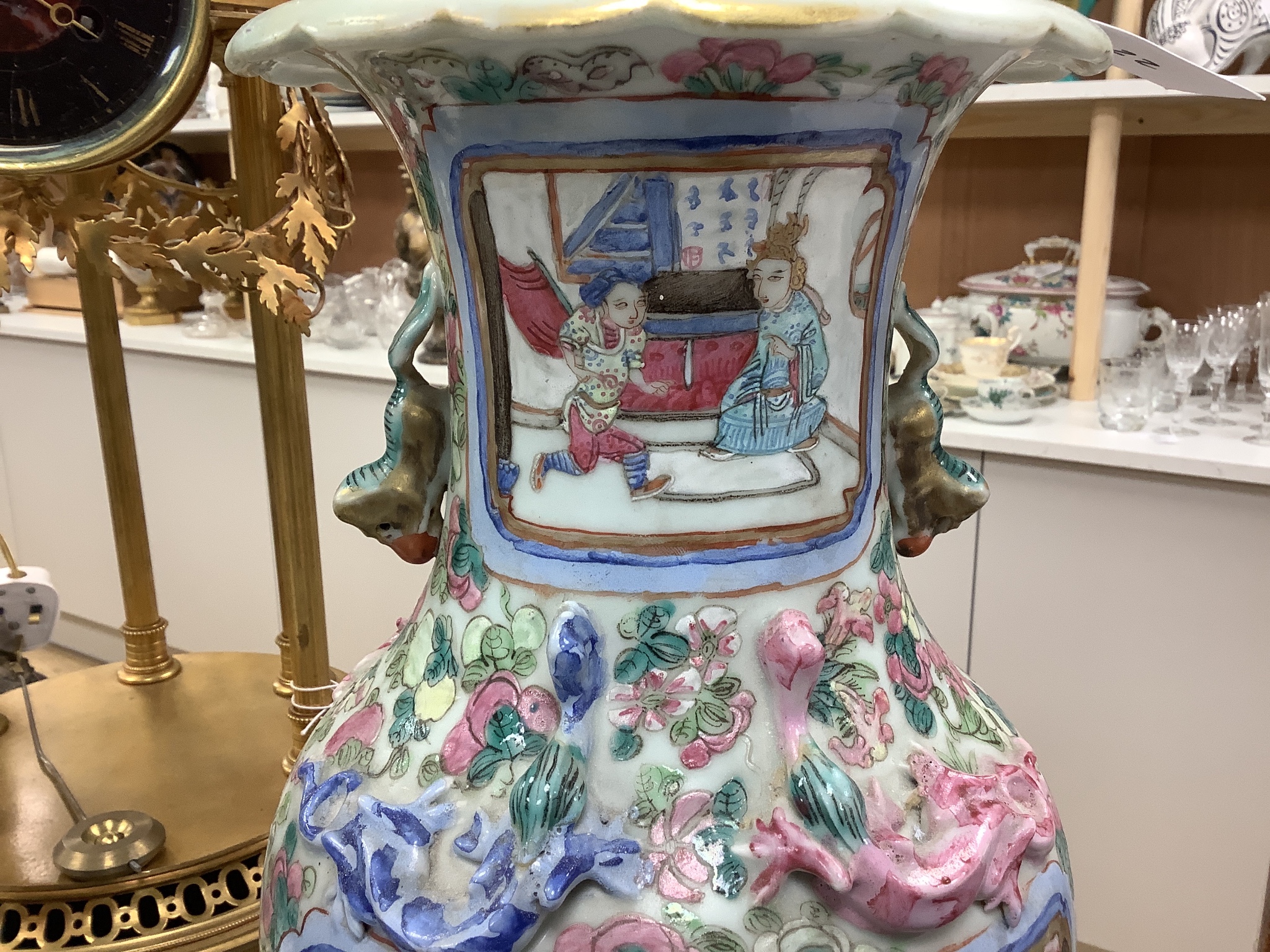 A pair of 19th century Chinese famille rose baluster vases, fitted as table lamps, on hardwood stands